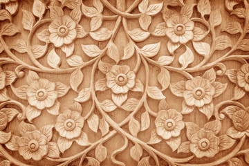 pattern of flower carved on wood background