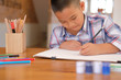 © 88studio - asian kid boy child schoolboy drawing picture. children activity at home