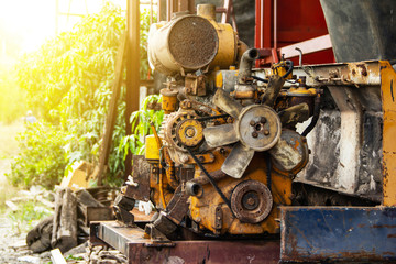 old rusted engine rear end of excavator or backhoe small in the garage repair.