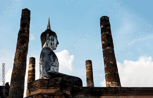 Fotografie, Obraz Ancient Buddha Statue at Sukhothai historical park, Mahathat Temple ,Thailand