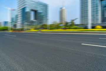 city empty traffic road with cityscape in background.