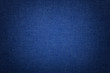 Navy blue background from a textile material with wicker pattern, closeup.