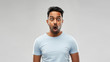 © Syda Productions - emotion, expression and people concept - shocked or scared man in t-shirt over grey background