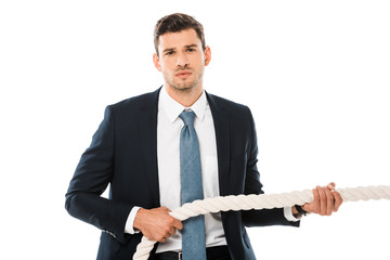 Wall Mural - tense businessman pulling rope and looking at camera isolated on white