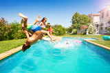 Fototapeta  - Active teens spending summertime by the pool