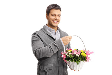 Sticker - Smiling young man holding a basket with flowers