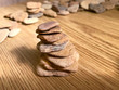 Flat sea stones on the table.
Flat sea stones on the table, folded pyramid.
