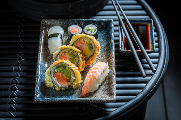 Wall Mural - Sushi mix with wasabi and soy sauce on dark table