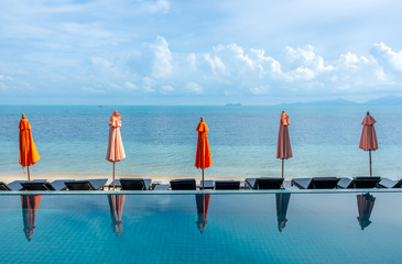 umbrellas reflect with pool water
