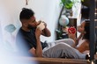 © Wavebreak Media - Couple having coffee in stairs at home