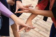 © Ivan - Close up of high five hand gesture, symbol of common celebration or greeting. Success and teamwork concept