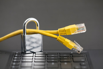 Poster - Internet security concept. Padlock with internet cables on computer keyboard 