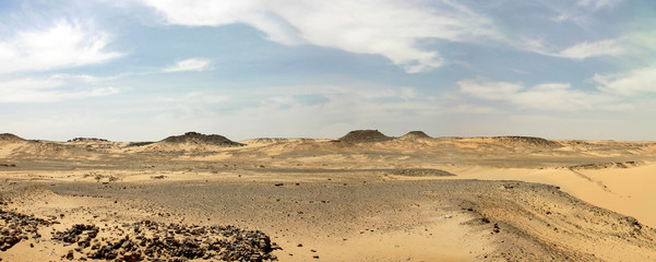 Libyan desert with cloudy blue sky in Egypt