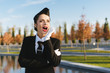 © mnelen.com - beautiful woman stewardess in uniform screaming, looking up at the sky on airplane