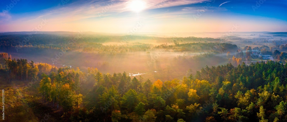 Aerial landscape with foggy sunrise over meadows and forest - obrazy, fototapety, plakaty 