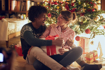 couple holding Christmas box