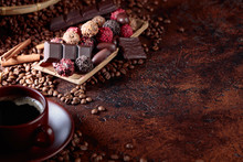 Various Chocolates  And Cup Of Black Coffee.