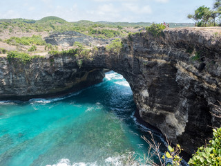 Wall Mural - Beautiful natural sea pool Broken Bay. Bali travel destination. Nusa Penida island day tour popular place. Activity on beach holiday with kids. Indonesia, october, 2018