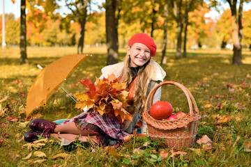 happy teenager smiling. Autumn portrait of beautiful young girl in red hat