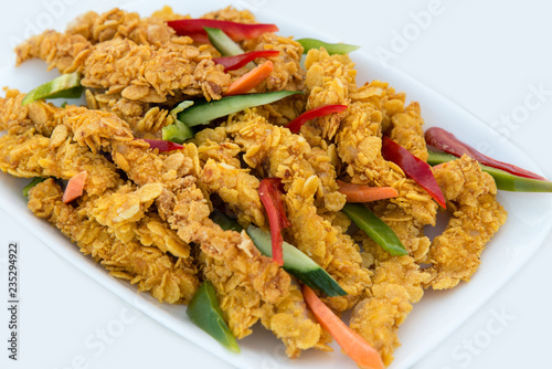 Fotografie, Obraz close-up of delicious crispy fried chicken breast strips on white plate, on a wh