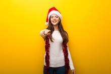 Teenager Girl Celebrating Christmas Holidays Points Finger At You