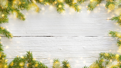 Wall Mural - Christmas and New Year white wooden background with fir branches and lights