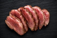 Medium Rare Venison Steak On Rustic Dark Stone Board