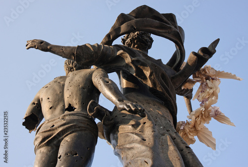 Fotomural Statue on Martyrs' Square in Beirut, Lebanon, with bullet holes