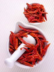 Wall Mural - WHOLE RED DRIED CHILLIES IN PESTLE AND MORTAR