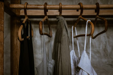Boho Chic Open Wardrobe, Clothing Rack, Rattan Wooden Hangers, Fashion Blogging Concept, Neutral Colors. Loft Bedroom Interior Design. 