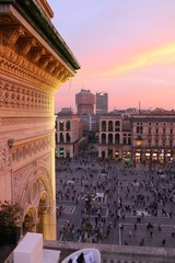 Milano, Italy. View of Duomo square from the top of Galleria Vittorio Emanuele II with Sunset colorful sky.