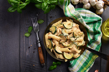 Wall Mural - Penne pasta witch chicken and zucchini in cheese sauce