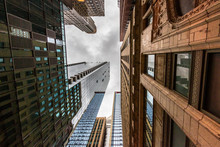 Wide-angle View Looking Up Through Tall Buildings And Skyscrapers In Downtown Chicago Illinois