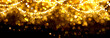 Christmas golden glowing background. Gold holiday abstract glitter defocused backdrop with blinking stars and garlands. Tinsel blurred gold bokeh on black background