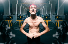 Thin Guy Poses On Workout In Gym, Dystrophic