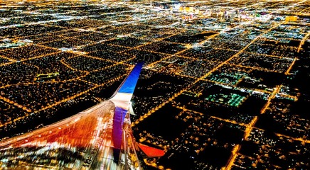 Fototapete - Las Vegas City lights from airplane at night