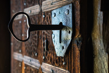 Big Key In Rustic Door Of Wooden Church