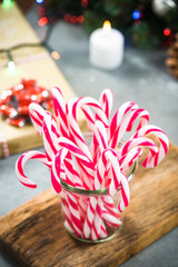 Wall Mural - Jar with festive candy cane on christmas table