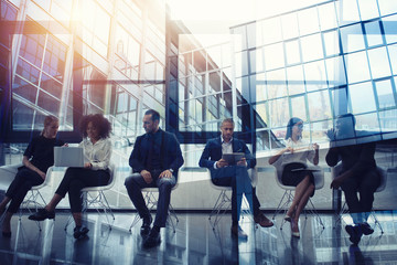 Wall Mural - Business people connected on internet network with laptop and tablet. concept of startup company. double exposure