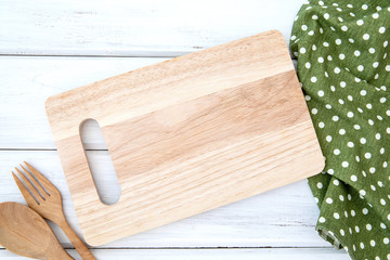 Sticker -  a chopping board and tablecloth with wooden fork and spoon on white table , recipes food  for healthy habits shot note background concept