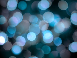 bright blue defocused glittering round blurred lights abstract shining background