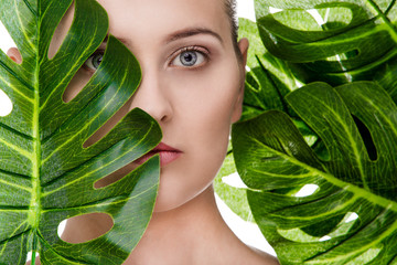 Beautiful woman portrait with tropical plant