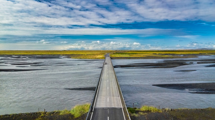 Poster - Aerial landscape view of a bridge with a car crossing and riverbed in Iceland