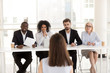 © fizkes - Serious focused diverse hr recruiting people group listening applicant performance at job interview, multi-ethnic recruiters team make decision consider hiring seeker thinking about first impression