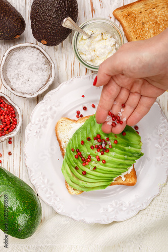 Preparation Of Bread Toast With Avocado Cottage Cheese Ricotta