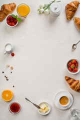 Continental breakfast captured from above - on concrete background