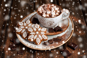 Wall Mural - Hot cocoa with marshmallows and gingerbread cookies on the wooden background. Christmas concept