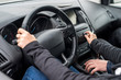 © RomanR - Instructor's hands helping driver to drive a car