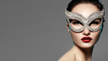 Beautiful Model With Fashion Lips Makeup Wearing Bright Brilliant Mask. Masquerade Style Woman. Holiday Celebration Look