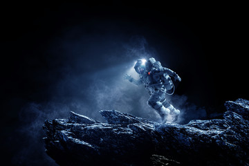 Wall Mural - Spaceman running fast. Mixed media